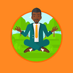 Image showing Businessman meditating in lotus position.