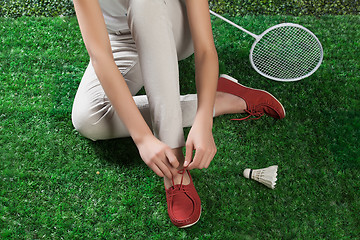 Image showing Woman\'s Legs And Badminton Racket