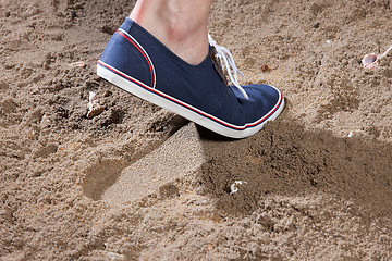 Image showing Man\'s Legs And Footprint On The Sand