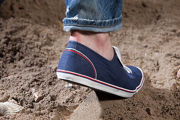 Image showing Man\'s Legs And Footprint On The Sand