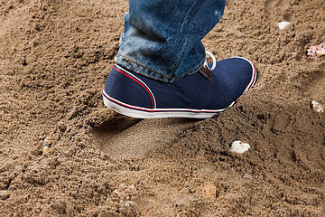 Image showing Man\'s Legs And Footprint On The Sand