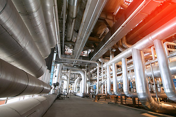 Image showing Equipment, cables and piping as found inside of a modern industr