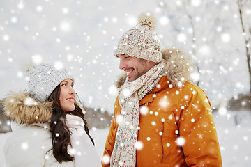 Image showing happy couple walking over winter background