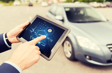 Image showing close up of man with tablet pc diagnoses car