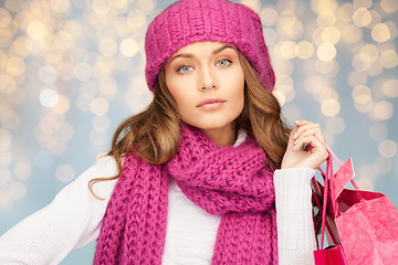 Image showing happy woman in winter clothes with shopping bags