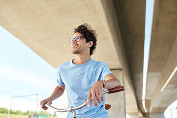 Image showing young hipster man riding fixed gear bike