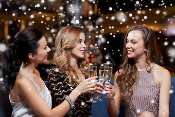 Image showing happy women with champagne glasses at night club