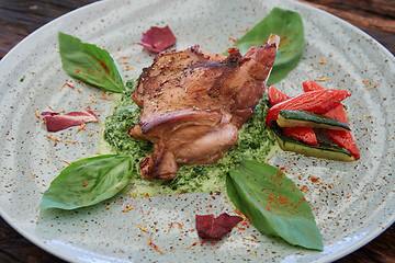 Image showing cooked rabbit meat with spinach and raisins