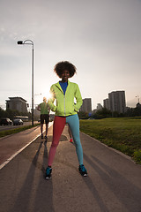 Image showing Portrait of sporty young african american woman running outdoors