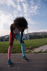 Image showing Portrait of sporty young african american woman running outdoors