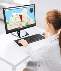 Image showing businesswoman with gps navigator map on computer