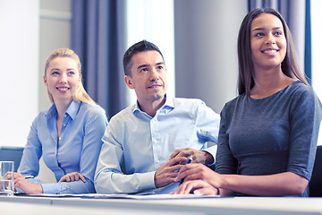 Image showing group of smiling businesspeople meeting in office