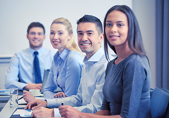 Image showing group of smiling businesspeople meeting in office