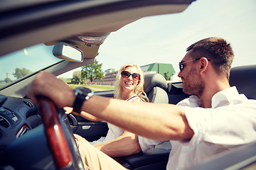 Image showing happy man and woman driving in cabriolet car