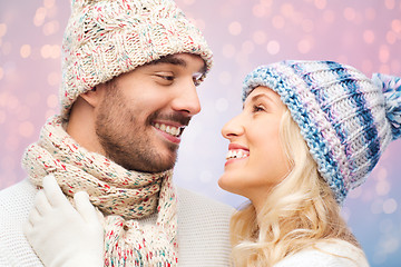 Image showing smiling couple in winter clothes hugging