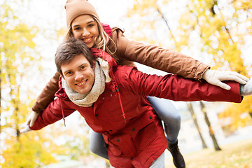 Image showing happy young couple having fun in autumn park