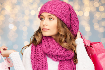 Image showing happy woman in winter clothes with shopping bags