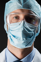 Image showing close up of scientist in goggles, mask and hat