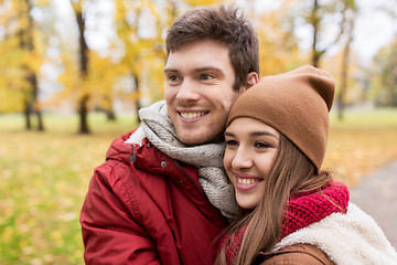 Image showing happy young couple walking in autumn park