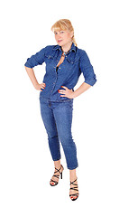 Image showing Woman in jeans clothing standing.