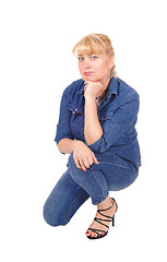 Image showing Woman kneeling on floor. 