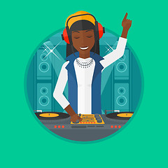 Image showing Smiling DJ mixing music on turntables.