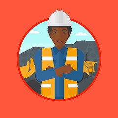 Image showing Miner with a big excavator on background.