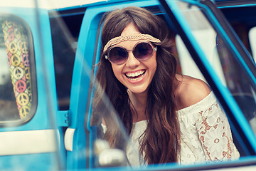 Image showing smiling young hippie woman in minivan car