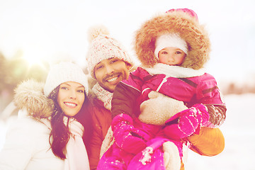 Image showing happy family with child in winter clothes outdoors