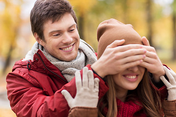 Image showing happy young couple having fun in autumn park