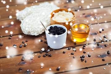 Image showing homemade coffee scrub, honey and wisp on wood