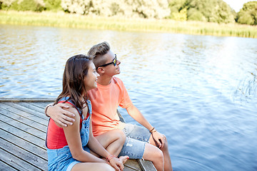 Image showing happy teenage couple hugging on river berth