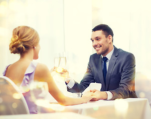 Image showing couple with glasses of champagne at restaurant