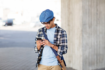 Image showing hipster man texting message on smartphone