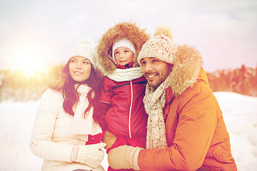 Image showing happy family with child in winter clothes outdoors