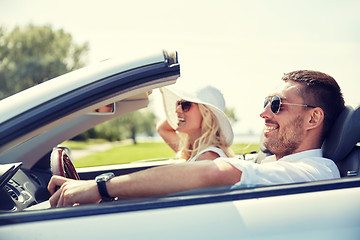 Image showing happy man and woman driving in cabriolet car