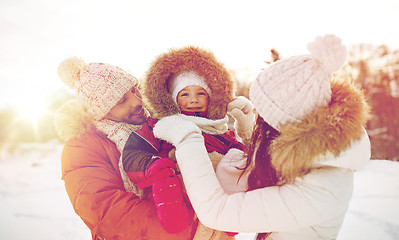 Image showing happy family with child in winter clothes outdoors