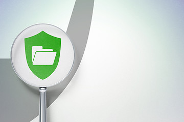 Image showing Business concept:  Folder With Shield with optical glass on digital background