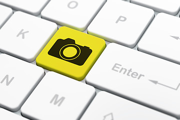 Image showing Tourism concept: Photo Camera on computer keyboard background