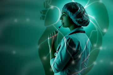 Image showing Collage on scientific topics. Young female doctor standing against heart background