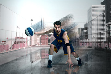 Image showing Full length portrait of a basketball player with ball