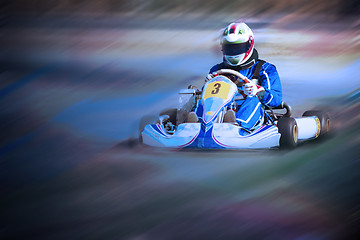 Image showing Karting - driver in helmet on kart circuit