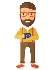 Image showing Photographer holding his camera