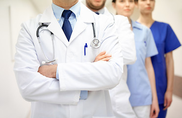 Image showing close up of medics or doctors at hospital corridor