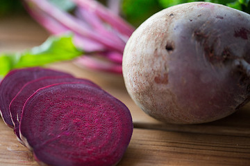 Image showing close up of sliced beet on wood