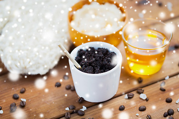 Image showing coffee scrub in cup and honey on wood