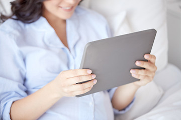 Image showing close up of pregnant woman with tablet pc at home