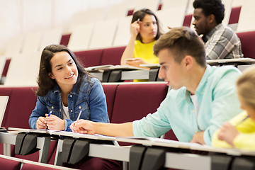 Image showing group of students with notebooks in lecture hall