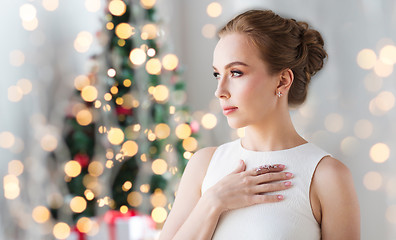 Image showing woman wearing diamond jewelry for christmas