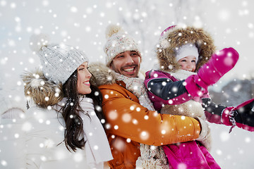 Image showing happy family with child in winter clothes outdoors